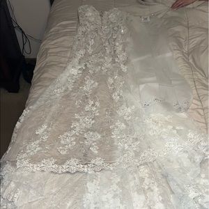 I’m selling my wedding dress. It’s from David’s Bridal. Never worn. Brand new